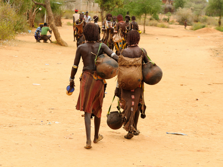Local Ethiopian people coming back from the market from the Turmi village in the Omo valley in Ethiopiaのeditorial素材