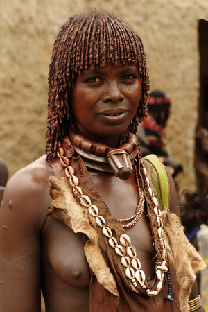 TURMI, OMO VALLEY, ETHIOPIA - JULY 29: Portrait of the woman from Hamer people in transit to the local marketplace in Turmi, Omo valley in July 29, 2013のeditorial素材