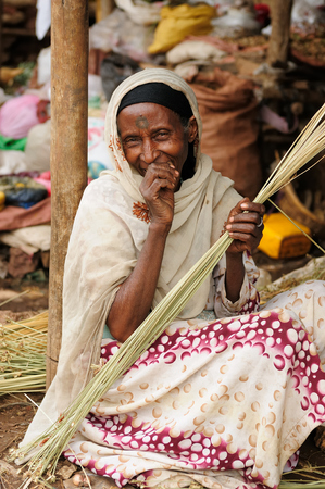 BAHYR DAR, ETHIOPIA - AUGUST 12: Portrait of the woman weaving baskets on the market in Bahyr Dar in August 12, 2013のeditorial素材