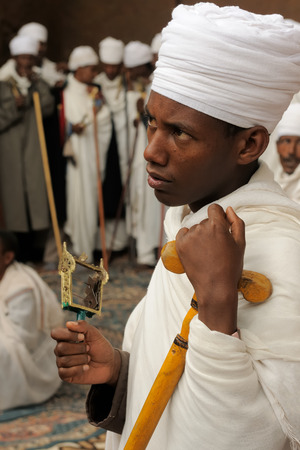 LALIBELA, ETHIOPIA - AUGUST 30: Ethiopian pilgrim is praying in the complex of temples in solid rock in Lalibela, Ethiopia in Lalibela in August 30, 2013のeditorial素材