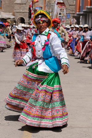 Chivay, PERU - DECEMBER 11: Dancers in traditional dresses on the festival Wititi UNESCO in the Chivay town in the Colca canyon in December 11, 2011のeditorial素材