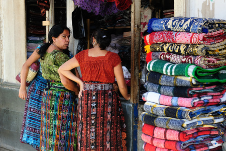 SAN PEDRO LA LAGUNA, GUATEMALA - JANUARY 20: Ethnic women from Guatemala are doing the shopping of colour materials in order to make new dresses for oneself in the city San Pedro La Laguna in Central America in January 20, 2013のeditorial素材