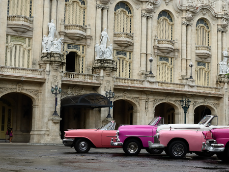 HAVANA, CUBA - 10 DECEMBER 2016: Old American cars serving as taxis for tourists in order to go on a tour of old Havana standing in the Central Park in the heart of Havana, Cubaのeditorial素材