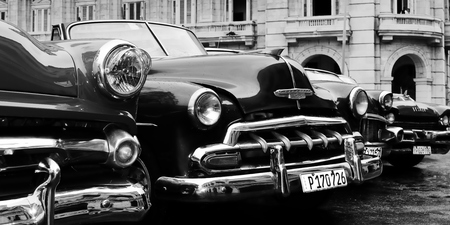 HAVANA, CUBA - 10 DECEMBER 2016: Old American colourful cars serving as taxis for tourists in order to go on a tour of old Havana standing in the Central Park in the heart of Havanaのeditorial素材