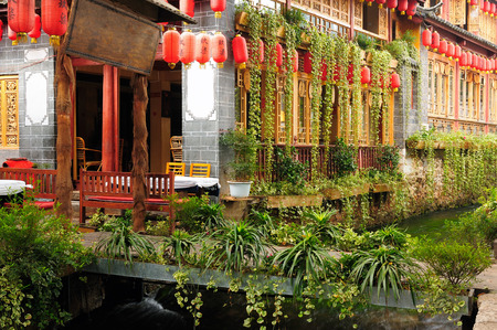 Lijiang old city, Wooden architecture detail, China. Yunnan province. Lijiang is famous for its UNESCO Heritage Site, the Old Town of Lijiang in crowds visited by Chinese touristsのeditorial素材