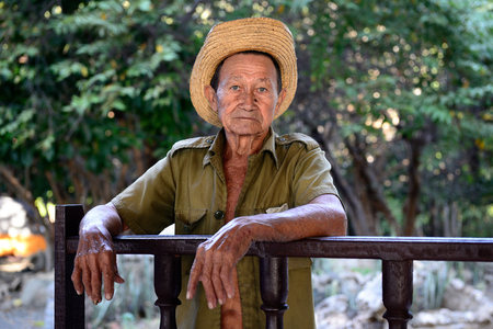 LA MULA, SANTIAGO DE CUBA, CUBA - NOVEMBER 26: Portrait of the of the sad Cuban farmer on deaths of Fidel Castro photographed in the heart of the Cuban revolution Sierra Maestra mountains on Cuba, La Mula in November 26, 2016のeditorial素材