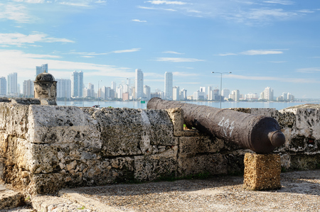 Cartagena - the colonial city in Colombia is a beautifllly set city, packed with historical monuments and architectural treasures. The picture present view on the new town through curtain walls of the old town armed into cannonsのeditorial素材