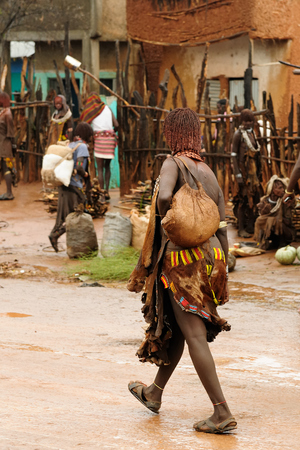 Local Ethiopian people coming back from the market from the Dimeka village in the Omo valley in Ethiopiaのeditorial素材
