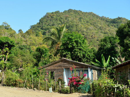 Wooden house in one of villages by the trail for the highest peak on Cuba Pico Turquino being in a mountain range Sierra Maestra on Cubaのeditorial素材