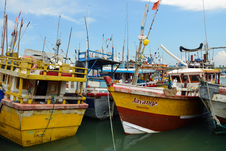 TANGALLE, SRI LANKA - 26 FEBRUARY 2015: Fishing cutters in the fishing harbour in Tangalleのeditorial素材