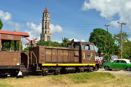 VALLE DE LOS INGENIOS, CUBA - 10 NOVEMBER 2016: Tower in the valley to guarding the sugar plantation and train to the transport of the sugar cane now being used for a transport of tourists within the valleyのeditorial素材