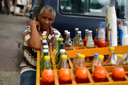 SANTIAGO DE LOS CABALLEROS, DOMINICAN REPUBLIC - 13 DECEMBER 2017: Street seller of juicans on the Republic of Dominican Republicのeditorial素材