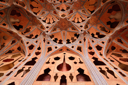 ESFAHAN, IRAN - 26 OCTOBER 2018: Patterned ceiling contrasts with shapes of music instruments in Ali Qapu Palace, situated at Naqsh e Jahan Squareのeditorial素材