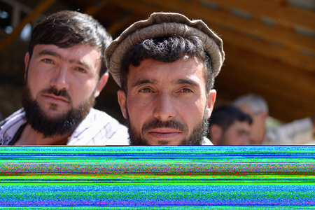 KHOROG, PAMIR MOUNTAINS, TAJIKISTAN - 06 JULY 2019: Portrait of the people of Afghanistan which is trading on the market in Tajikistan in the Pamir Mountainsのeditorial素材