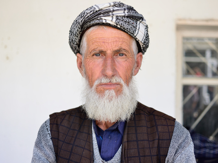 KHOROG, PAMIR MOUNTAINS, TAJIKISTAN - 06 JULY 2019: Portrait of the people of Afghanistan which is trading on the market in Tajikistan in the Pamir Mountainsのeditorial素材