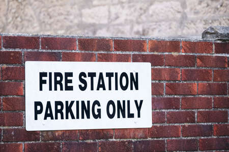 Fire station parking only on wall car park sign