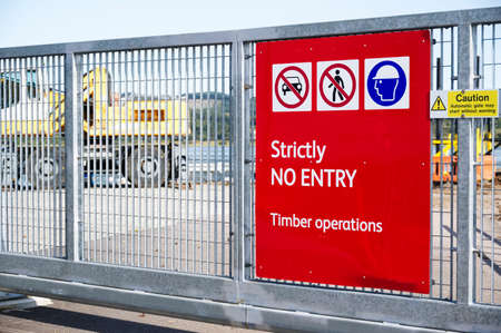 Construction building timber site sign at entrance on gate