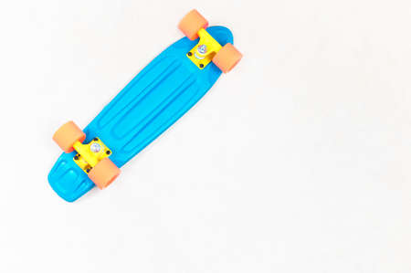 Skateboard cruiser style blue yellow and orange view from aboveの写真素材