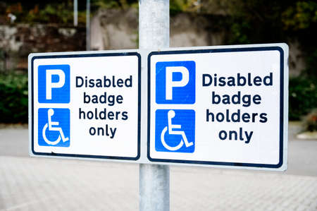 Disabled blue badge holder parking sign for driverの写真素材