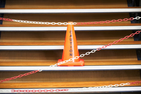 Caution red cone safety notice at workplace office stairの写真素材