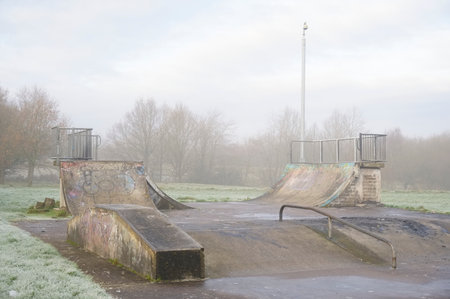 Skateboard concrete park empty derelict playground in winterの写真素材