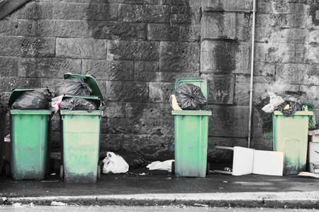 Fly tipping of waste and rubbish black bin bags in residential area