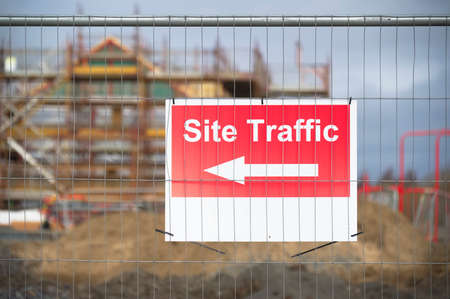 Site traffic direction sign at construction site entranceの写真素材