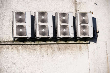Condenser units for air conditioning system wall mounted outdoorsの写真素材