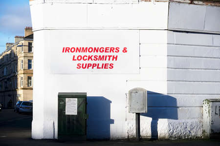 Ironmongers and locksmith supplies sign on wall