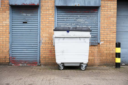 Wheelie bin skip for refuge collection in rowの写真素材