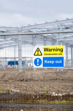 Construction site health and safety message rules sign board signage on fence boundary