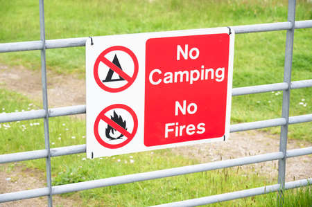 No camping no fire sign on entrance gateの写真素材