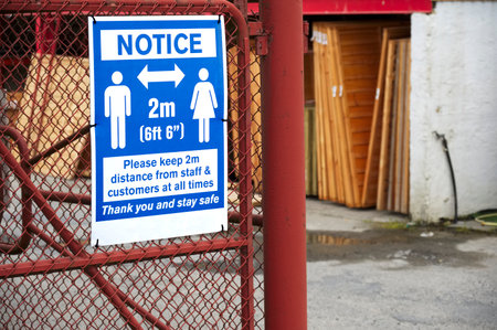 Social distancing sign shop customers to respect and stay safe