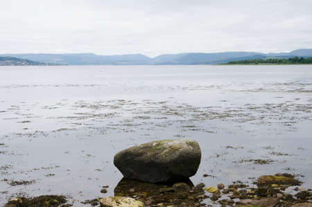 Mindfulness calm background view from loch in moody sunrise sky in Scotland