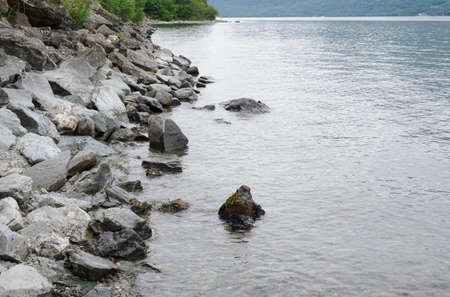 The shore of Culag beach on Loch Lomondの写真素材