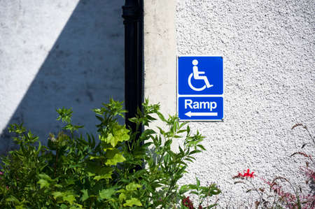 Ramp access for disabled wheelchair users sign at entranceの写真素材