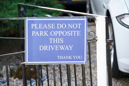 No parking private driveway sign outside house