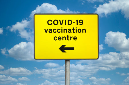 Vaccination medical centre for Covid-19 road signの写真素材