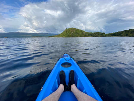 Blue kayak in Loch Lomond on open waterの写真素材