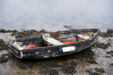 Old boats derelict on River Leven in Dumbartonの写真素材