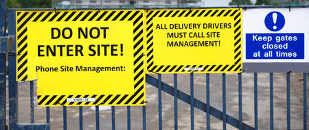 Do not enter construction in progress sign on fenceの写真素材
