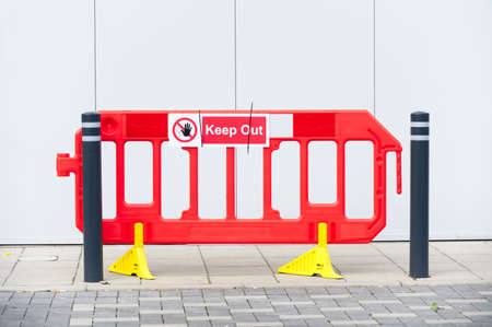 Keep out construction in progress sign on fenceの写真素材