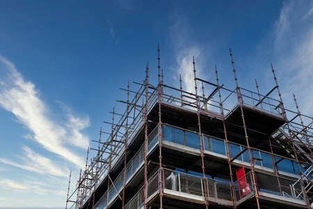 Scaffolding surrounding house development for safe access to construction workの写真素材