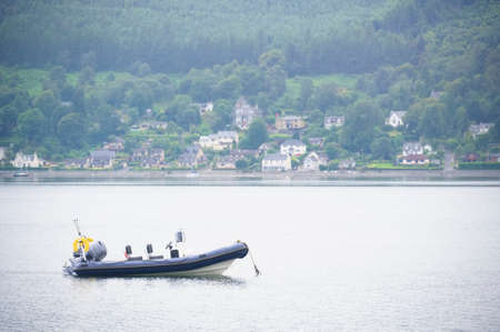 Inflatable dingy life rescue boat moored at marina