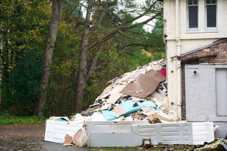 Demolition in progress of derelict house on construction building site