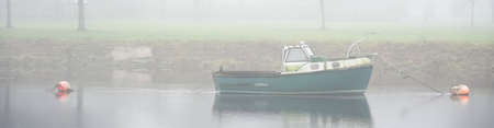 Old boat derelict on River Leven in Dumbartonの写真素材
