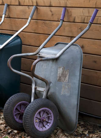 Gardening equipment and wheelbarrow in yard garden