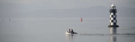 Inflatable dingy boat out on sea adventureの写真素材