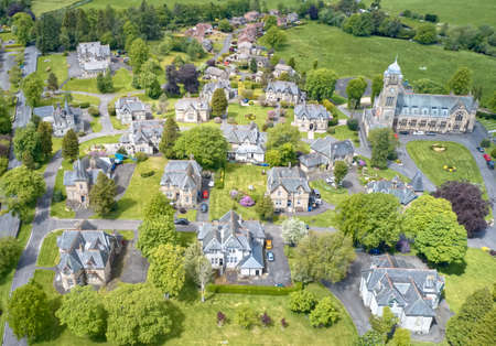 Luxury countryside rural village aerial view from above in Quarriers Village in Scotland