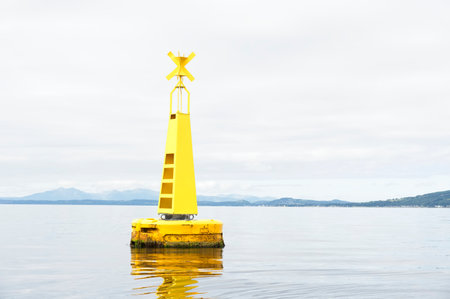 Buoy floating in Firth of Clyde for water depth warningの写真素材